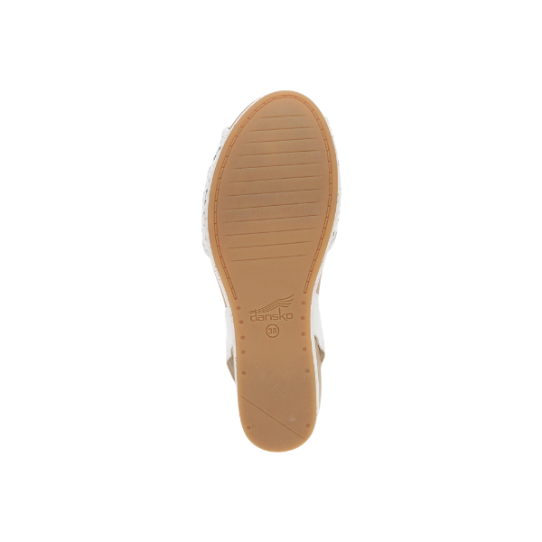 The image shows the stain-resistant tan sole of the DANSKO Women's Stella White sandal against a white background.