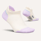 Pair of FEETURES Elite Max Cushion No Show Tab socks in Lilac Breeze, targeted arch compression, angled view.