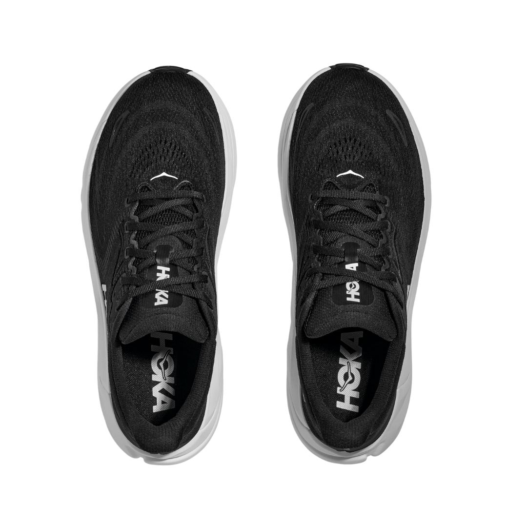 Top view of HOKA Mens Arahi 8 Wide Black/White stability running shoes with the HOKA logo on the insoles, white soles, and innovative H-frame technology for support, shown side by side on a white background.