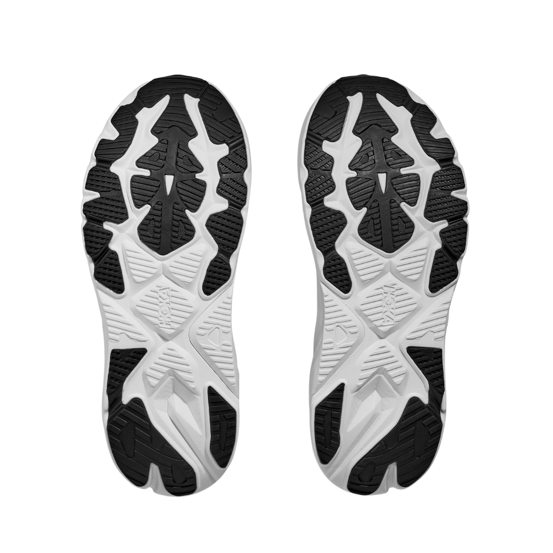 The HOKA Mens Arahi 8 Wide Black/White features black and white textured soles with angular lines and grooves for grip—ideal stability running shoes with advanced H-frame technology by HOKA.
