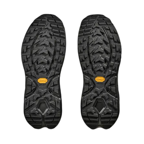 Black rubber sole of a shoe with a brand logo on a white background