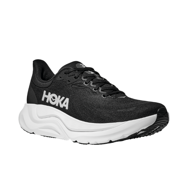 The HOKA Womens Arahi 8 Wide in Black/White features a thick white sole, black laces, and a white HOKA logo on the side, plus advanced H-frame technology, displayed at an angle against a plain white background.