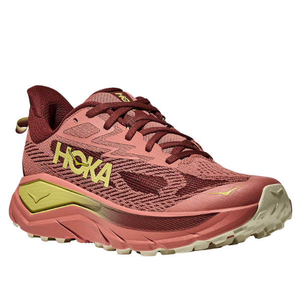 Pink running shoe with yellow accents on a white background