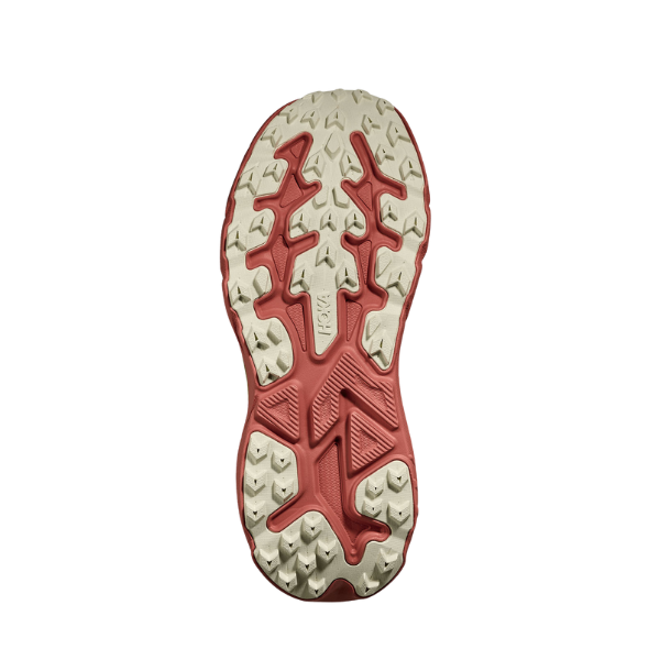 Close-up of a red and beige shoe sole on a white background