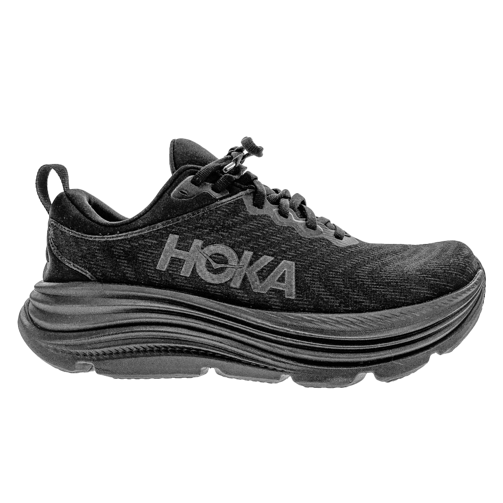 Side view of the HOKA Womens Gaviota 5 Wide Black, featuring a thick cushioned sole, mesh upper, HOKA logo, pull tab, quick-lace system, and Stabilizing H-Frame technology for support—ideal for reducing foot pain.