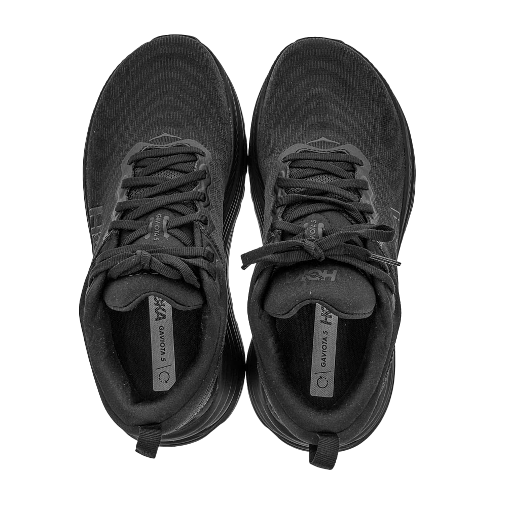 A pair of HOKA Womens Gaviota 5 Wide Black running shoes seen from above, highlighting the laces and tongue labels on a white background—featuring HOKA’s Stabilizing H-Frame technology to help reduce foot pain.
