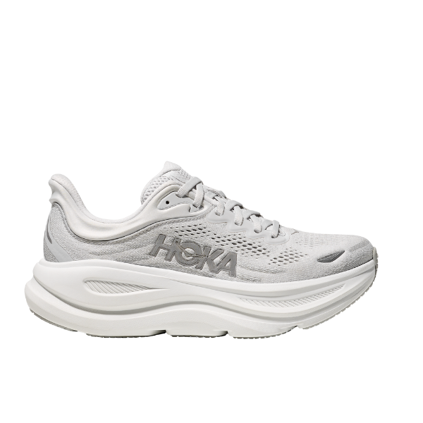 The HOKA Womens Bondi 9 Wide Grey running shoe features a light gray mesh upper, thick white cushioned sole, and is shown in a side profile view—ideal for comfort or plantar fasciitis relief.