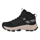 The TEVA Women's Grandview Max GORE-TEX Black hiking boot features a thick, textured sole, black and beige design, patterned ankle accents, black laces, and pull tabs on the tongue and heel in a side profile view.