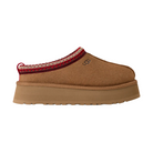 The UGG Women's Tazz II Chestnut is a stylish suede platform slipper with a thick tan sole, cozy sheepskin lining, red and white trim, and the signature UGG logo—ideal for comfort and style.