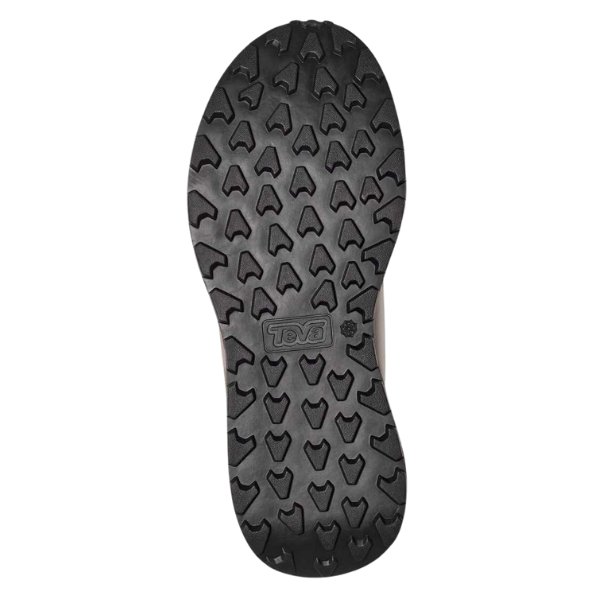 The image shows the sole of the TEVA Men's Ellwood Taupe Desert, a lightweight hiking sneaker with a rugged, triangular tread. The black, recycled sole features the TEVA logo and is designed for excellent outdoor traction.