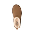 Top view of a single UGG Women's Classic Micro Chestnut boot with a suede finish, heel pull tab, and plush white shearling lining. The UGG logo appears on the insole.