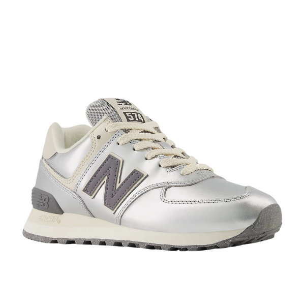 The NEW BALANCE Women's 574 in Metallic Silver/Arctic Grey is shown from the side on a white background.
