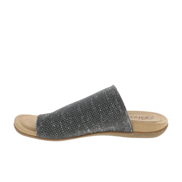 The BIZA FOOTWEAR Biza Womens Lavish Mocha Multi sandal features a stretch knit, dark gray textured upper and flat light brown sole, shown from the side on a white background.