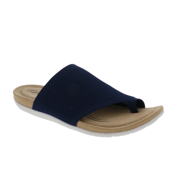 The Biza Womens Lavish Navy by BIZA FOOTWEAR is a navy stretch knit sandal with an open toe, Wide mesh strap, tan cushioned footbed for comfort, and a white textured sole—ideal as a comfortable travel sandal.