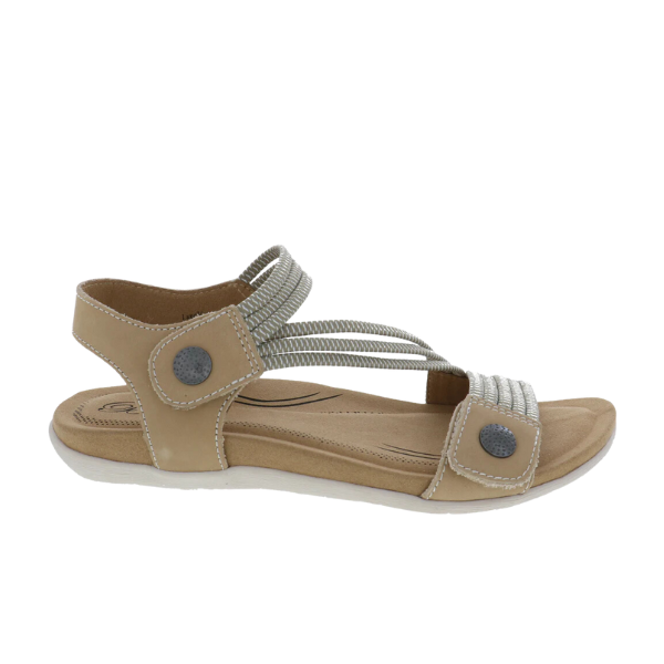 The Biza Womens Luna Sand by BIZA FOOTWEAR features cushioned soles, beige uppers, silver elastic straps, and round silver button details—offering comfortable walking sandals ideal for foot pain relief.