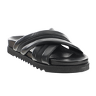 The Sovella Womens Coty Black sandal by SOVELLA features Wide, padded crisscross straps and a cushioned footbed with a textured black sole, delivering comfort and style in a versatile design.
