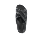 The Sovella Womens Coty Black sandal by SOVELLA features crisscross leather straps and a cushioned footbed, shown from above on a white background—a versatile addition to any wardrobe.