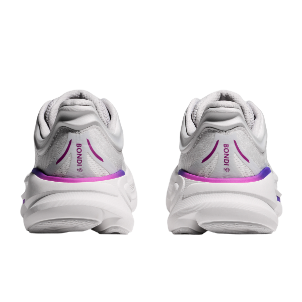 A pair of HOKA Womens Wide Bondi 9 running shoes in Cosmic Grey/White, shown from the back with BONDI on the heel and purple accents, designed for added cushioning and foot pain relief.