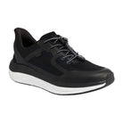 The KIZIK Womens London Black Wide features mesh fabric, rubberized accents, a white sole, and elastic toggle laces for easy wear, offering extra cushioning for comfort and foot pain relief. Shown against a white background.