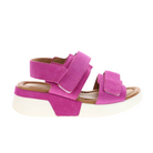 The SOVELLA Womens Maya Pink sandal features thick pink suede straps, white Velcro fastenings, a chunky white sole, and a cushioned insole for all-day comfort—perfect for adding a pop of color to your look.