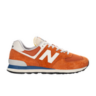 The NEW BALANCE Unisexs 574 Infield Clay/Sea Salt features orange suede and mesh, white laces, a white N logo, blue and gray midsole accents, and a black outsole—combining style and comfort in running shoes. Shown in left side profile.