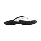 OLUKAI Women’s Ohana Lahi White Sand/Black sandal with contoured footbed, side view on white background.