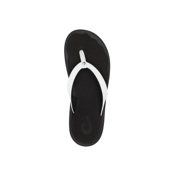 OLUKAI Women’s Ohana Lahi White Sand/Black sandal with thong strap, viewed from above on white background.