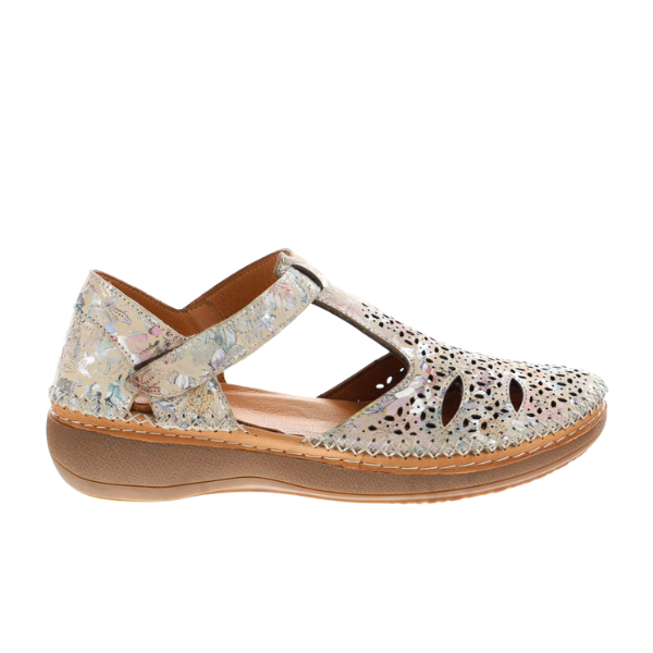 Side view of Sovella Womens Sabrina Multi by SOVELLA—a closed-toe sandal with cushioned insole, low tan sole, and multi-color floral-patterned upper with cut-out details and a hook-and-loop strap.