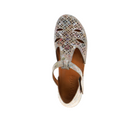 A single Sovella Womens Sabrina Multi sandal in a cutout floral design with a top strap, multicolored pattern, cushioned insole, and SOVELLA embossed on the brown footbed, viewed from above.