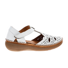 SOVELLA Sovella Womens Sabrina White sandal features white leather, a brown sole, cut-out patterns, decorative stitching, closed toe, open sides, hook-and-loop ankle strap, and a cushioned insole for all-day comfort.