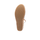 The image displays the sole of the Sovella Womens Sabrina White sandal by SOVELLA, featuring a textured diamond-pattern tread and flat heel for comfort, shown against a white background.
