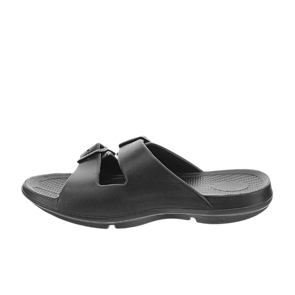 The SOVELLA Sovella Womens Buckle Slide Black sandal features two adjustable straps and a textured footbed for arch support, displayed in a side view on a white background.