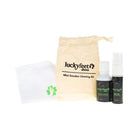 LUCKY FEET SHOE Mini Care Kit: two bottles, cloth, and beige travel bag labeled Lucky Feet Shoes.
