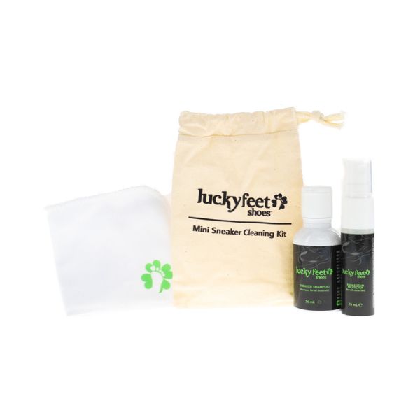 LUCKY FEET SHOE Mini Care Kit: two bottles, cloth, and beige travel bag labeled Lucky Feet Shoes.