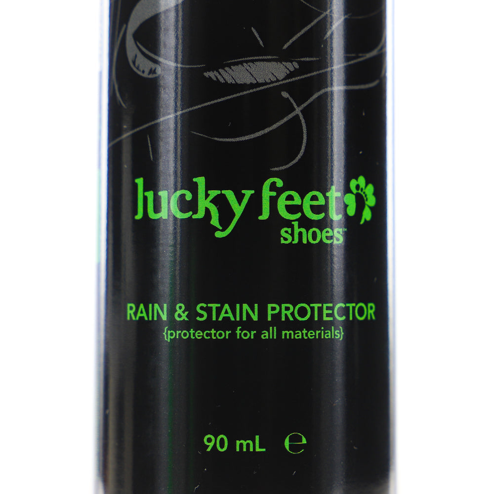 Close-up of a black LUCKY FEET SHOE Rain and Stain Protector spray, 90 mL, with green text.