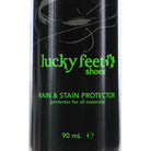 Close-up of a black LUCKY FEET SHOE Rain and Stain Protector spray, 90 mL, with green text.