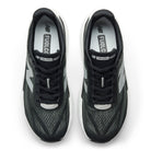 Top view of New Balance Men's Rebel v5 Black/White, a lightweight trainer with white soles and FuelCell branding.
