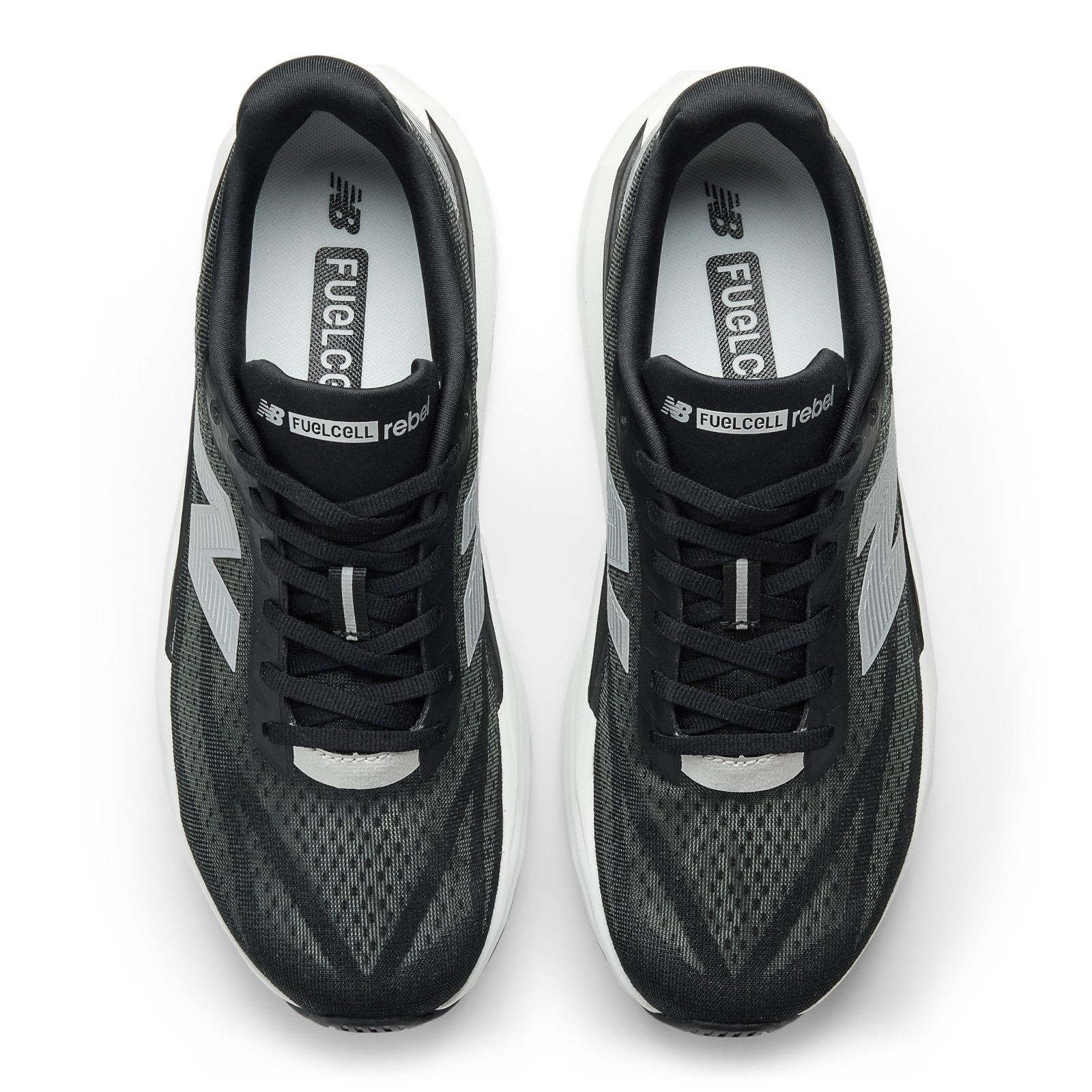 Top view of New Balance Men's Rebel v5 Black/White, a lightweight trainer with white soles and FuelCell branding.