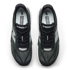 Top view of New Balance Men's Rebel v5 Black/White, a lightweight trainer with white soles and FuelCell branding.