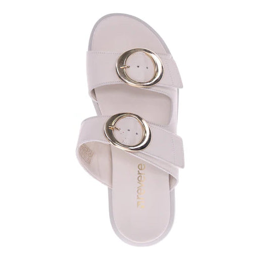 The REVERE Womens Mermaid Ivory sandal features two Wide beige straps with large round gold buckles, shown from above on a white background.