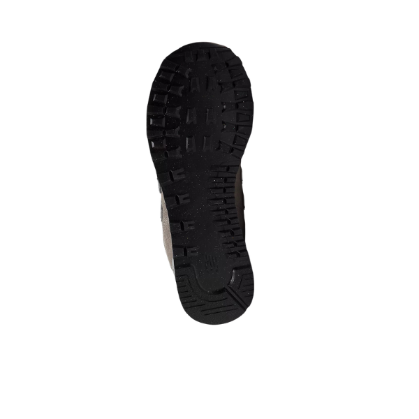 The black sole of the NEW BALANCE Mens 574 Core Neutral is shown from below, highlighting its rugged tread for grip and traction, making it versatile footwear against a plain white background.