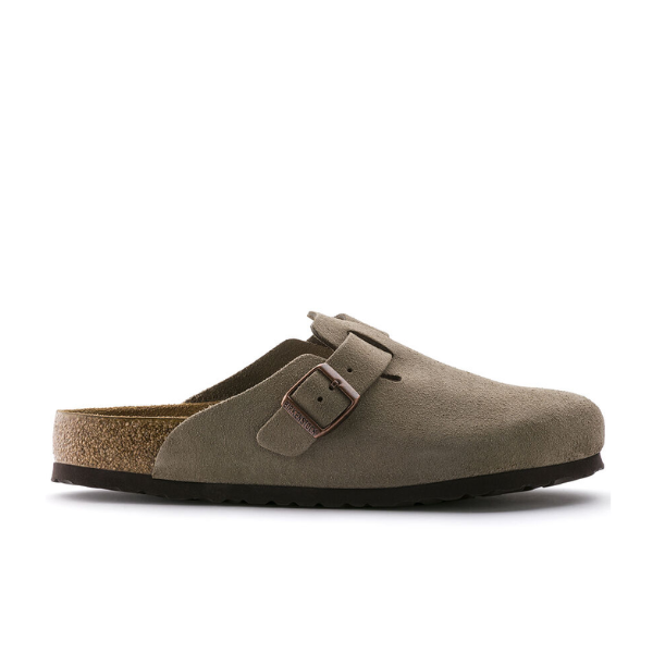 The BIRKENSTOCK Womens Boston Soft Footbed Taupe clog features a suede upper, black sole, and a single adjustable strap with metal buckle across the top for comfort and style.
