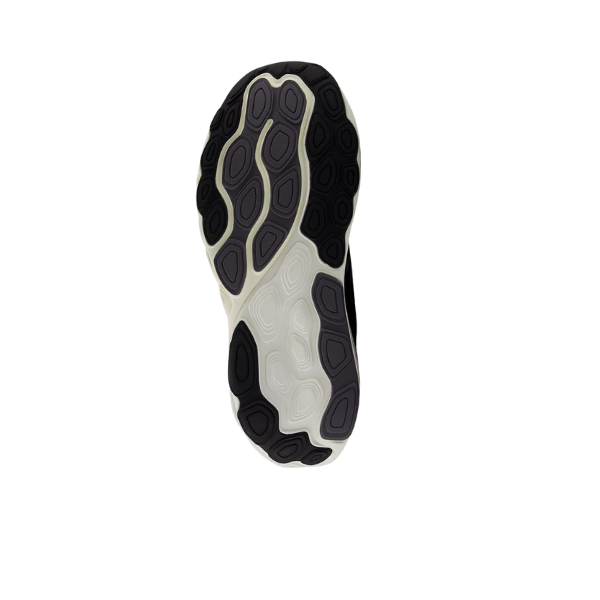 The image shows the sole of the New Balance Mens Fresh Foam 860v14 Black/White sneaker with a black and white pattern, wavy oval-shaped treads, and a Fresh Foam X midsole. The background is completely white.