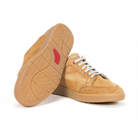 The FLUCHOS Fluchos Mens Leo F1722 Brown features tan suede, light brown rubber soles (one upright, one showing tread and red logo), white laces, and a minimalist design for stylish comfort and support.