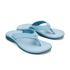 The OLUKAI Womens Ohana Misty Blue sandals feature thick straps, a comfort footbed, and water resistance, shown in light blue on a white background.