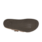 The image displays the sole of the Mephisto Womens Hannel Sandals in dark brown by MEPHISTO, featuring a unique tread design, an embossed logo by the heel, and a leather-lined cork footbed for superior comfort.
