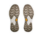 A pair of HOKA Mens Transport Wide Navy shoe soles with a brown and white chevron tread pattern and Vibrams yellow logo near the arch, displayed on a white background.