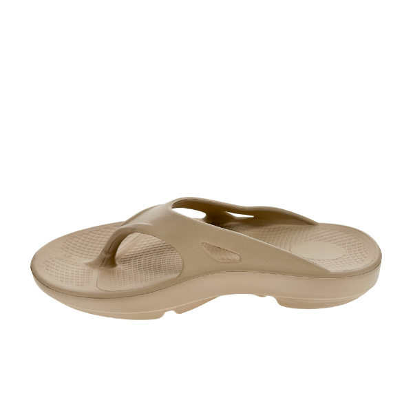 The Sovella Womens PF Thong Beige by SOVELLA features a contoured, thick sole with arch support and vented design, displayed on a white background.