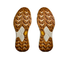 HOKA Womens Transport shoes in Cosmic Pearl/Oat Milk/Pink feature rugged, chevron-patterned vegan soles designed for hiking, shown from the bottom against a white background. Brand: HOKA.