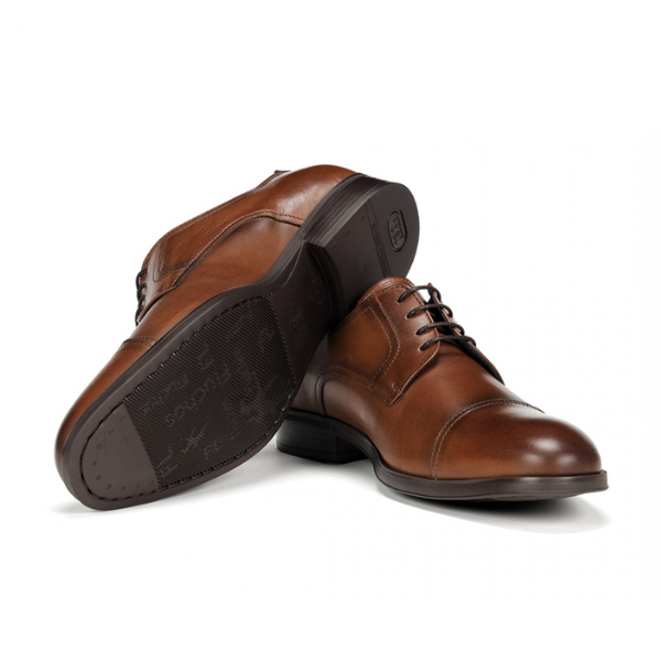 The FLUCHOS Mens Asgard F1885 Brown features a pair of comfortable brown leather dress shoes with laces—one upright, one on its side, highlighting the sole and heel—ideal for relieving foot pain with every step.